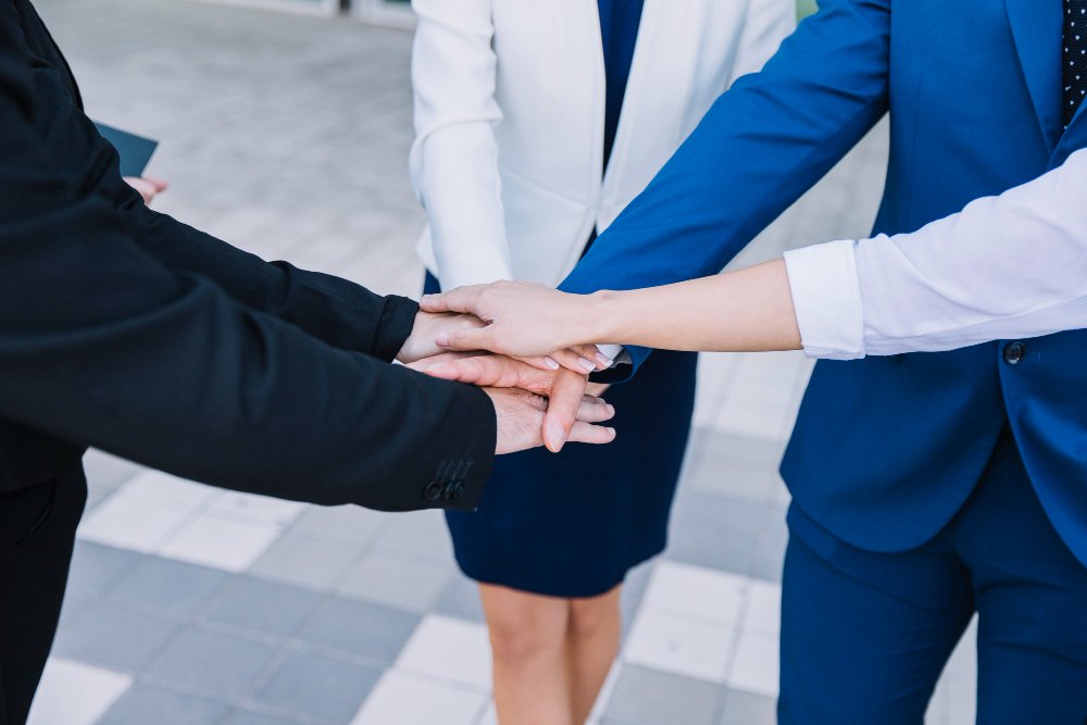 business-people-stacking-hands